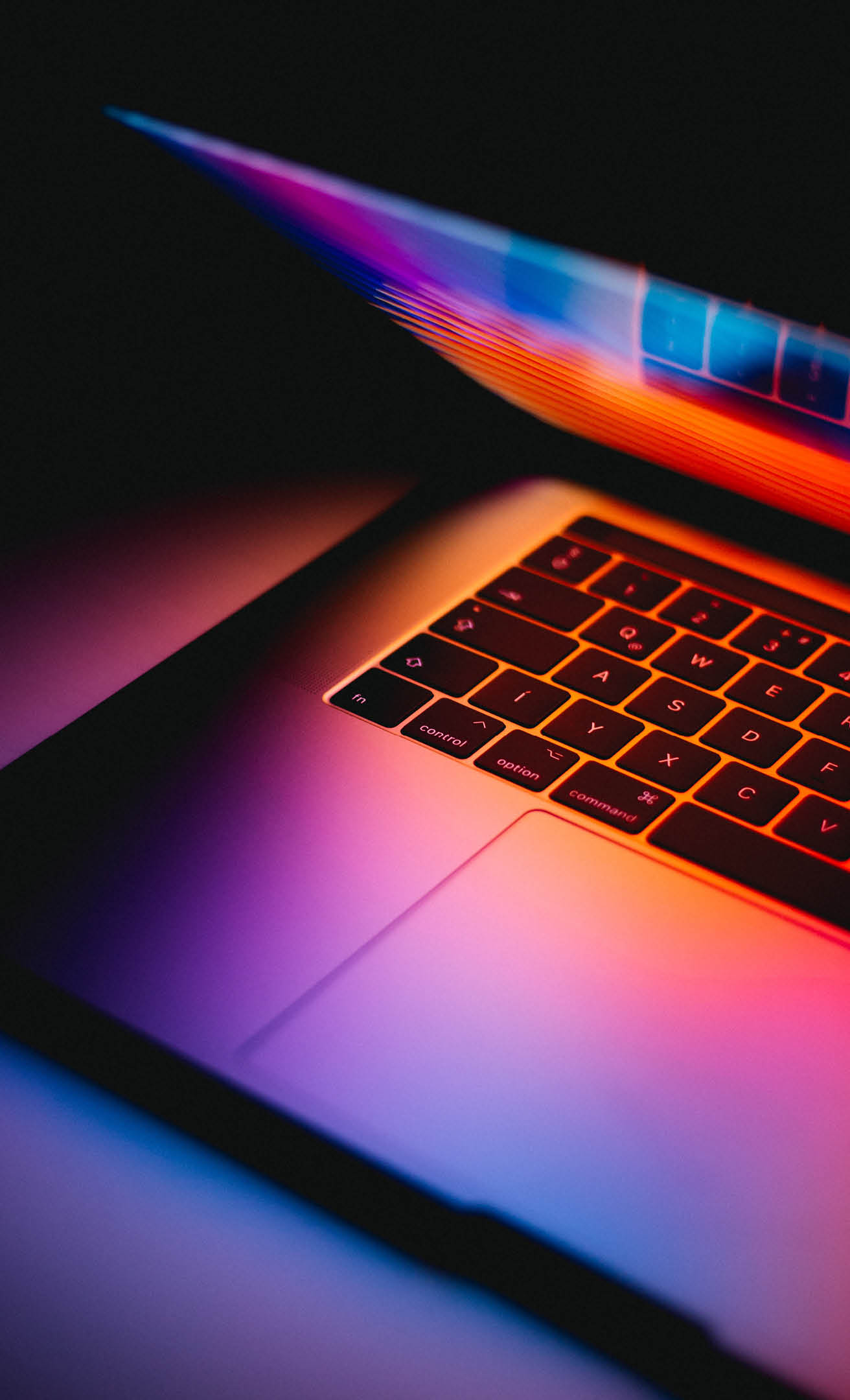 A laptop computer with a keyboard and screen. Description generated by AI